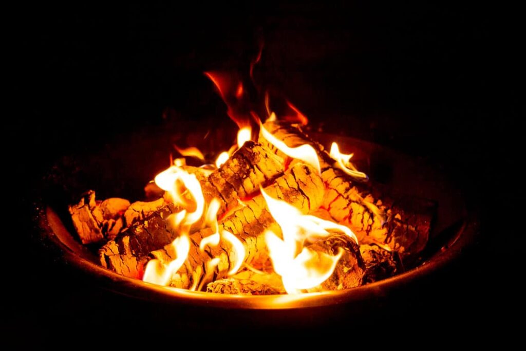 Fire Pit at night showing glowing embers.