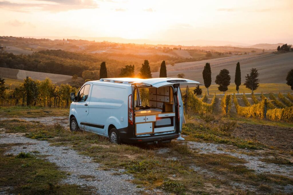 Vanlife - live in a beautiful bus in the open nature surrounded by grapevines and cypress trees